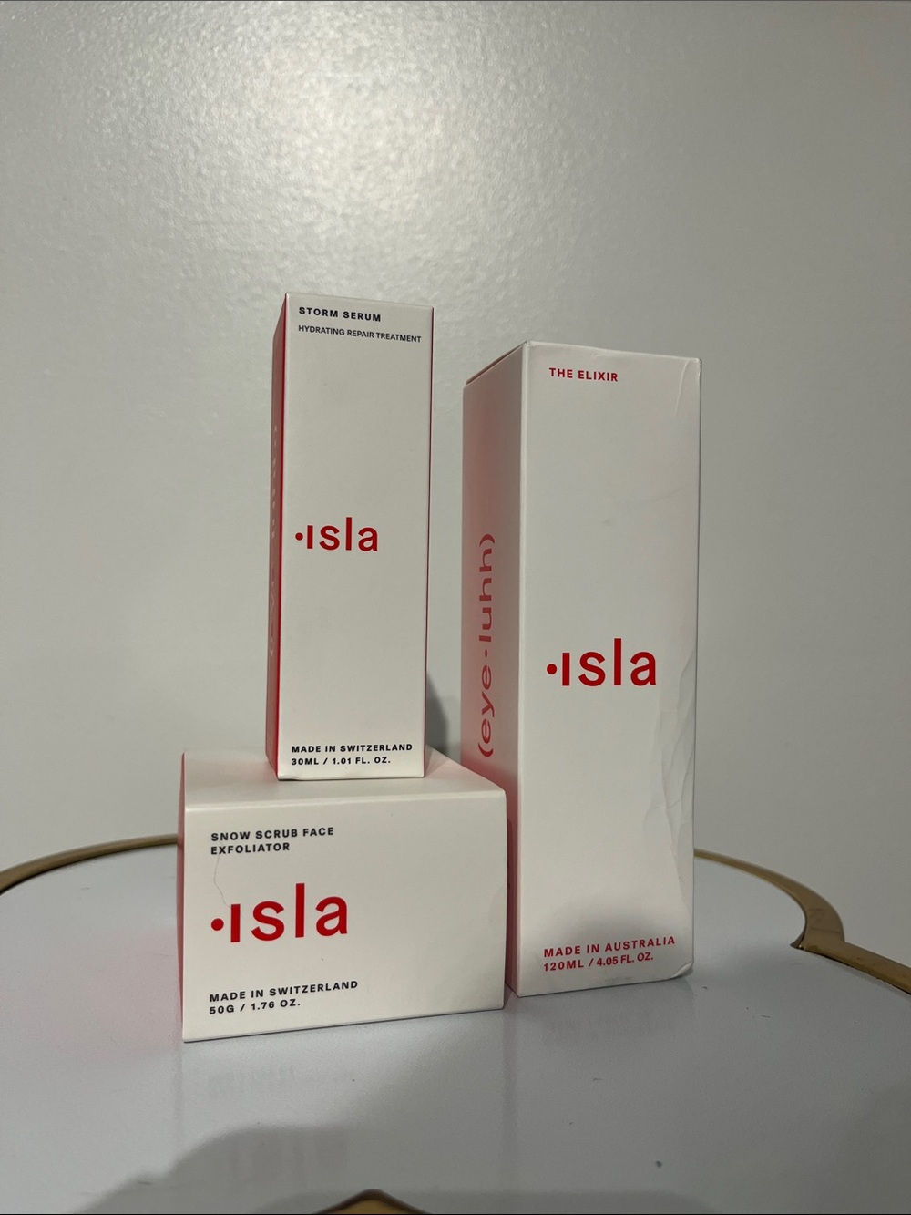 Isla three piece set Snow Scrub, The Elixir & Storm Serum NIB